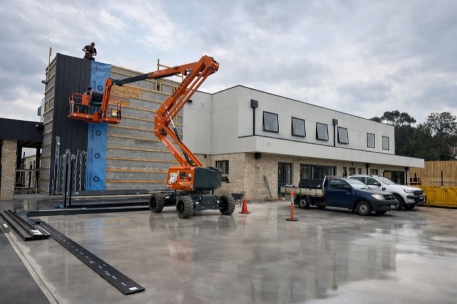 Boom lift and crew on site during the Treetop Early Learning build in Pascoe Vale